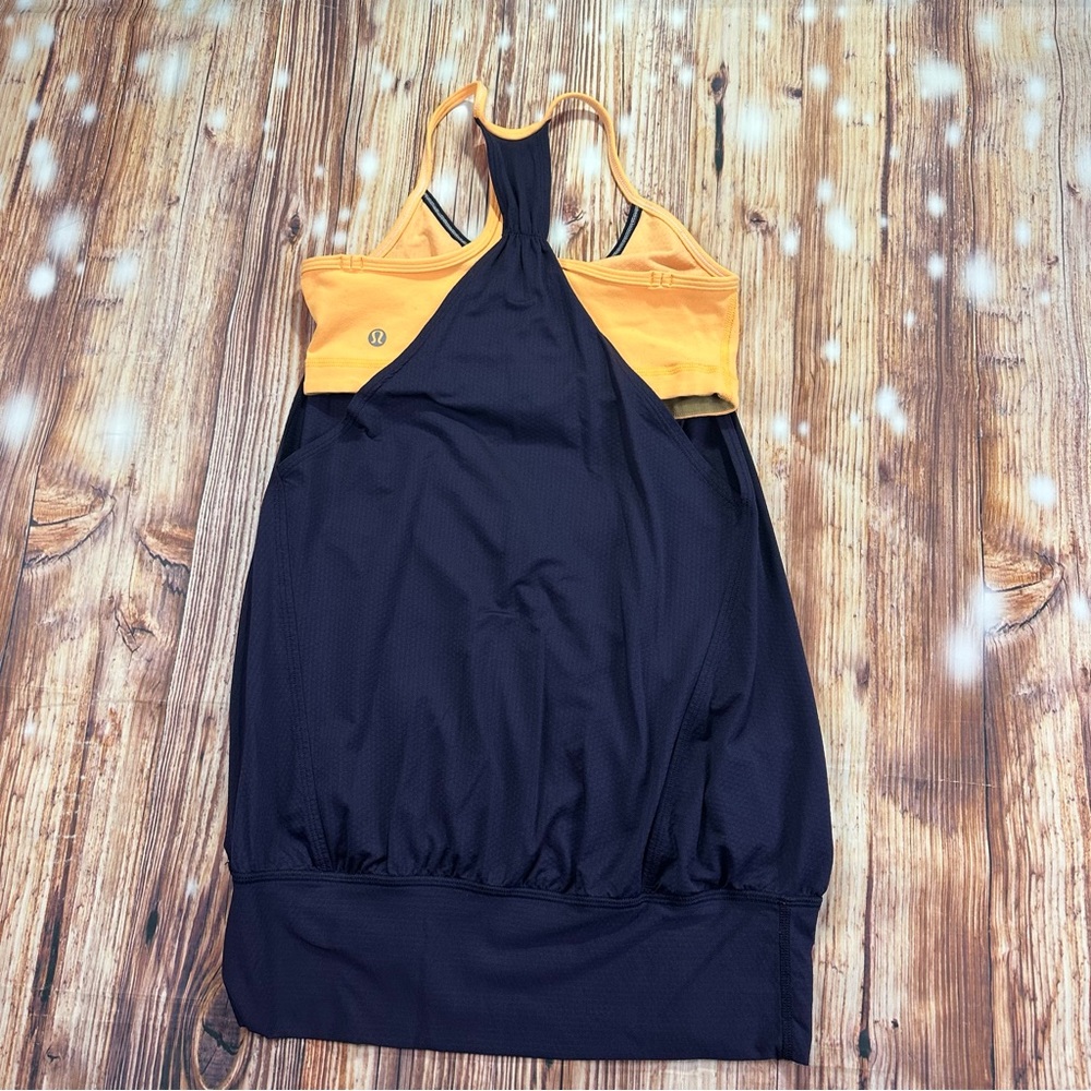 Lululemon Athletica Women’s No Limits Tank Top
Size 4  Black Swan/Creamsicle Pop